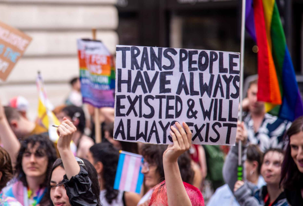 A group of people march at London Trans Pride, 8 July 2023. 