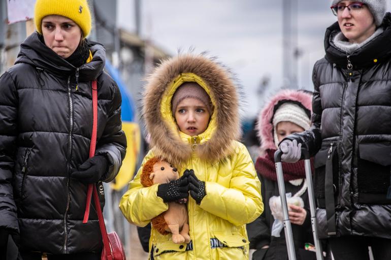 Families arrive in Berdyszcze, Poland, after crossing the border from Ukraine.