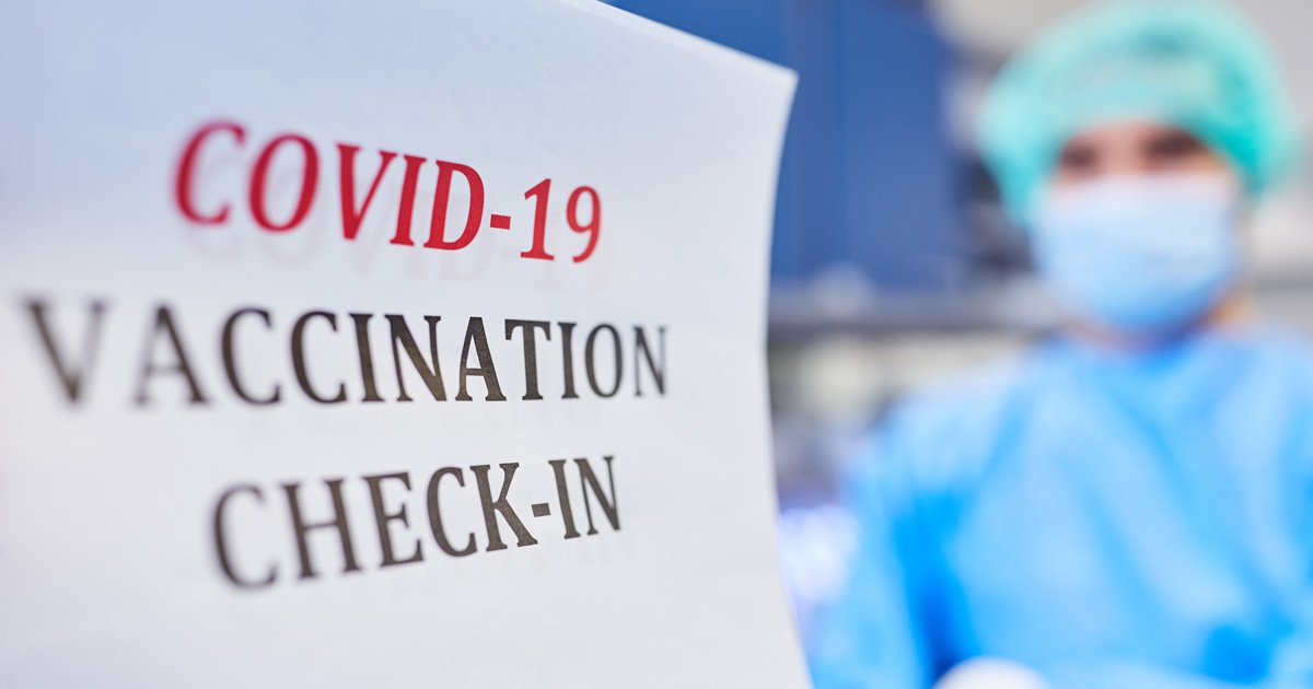 Banner written: "covid-19 vaccination check-in" 