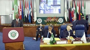 Secretary-General Kofi Annan (left) addressing the Summit of the League of Arab States, in Algiers. The Secretary-General visited Algeria to attend the Summit of the League of Arab States. Also present is Amre Moussa (center), Secretary-General of the Lea