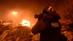 Journalist documenting events at the Independence square during the clashes in Ukraine, Kyiv, 18 February, 2014.