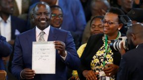 Kenya's Deputy President William Ruto and presidential candidate for the United Democratic Alliance (UDA) and Kenya Kwanza political coalition reacts after being declared the winner of Kenya's presidential election at the IEBC National Tallying Centre at 