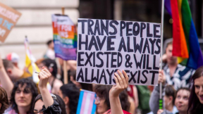 A group of people march at London Trans Pride, 8 July 2023. 