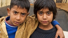 two Roma children embraced, "Dosta!" campaign, 2007