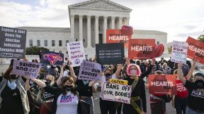 Abortion rights supporters and anti-abortion demonstrators rally outside the U.S. Supreme Court on Nov. 1, 2021
