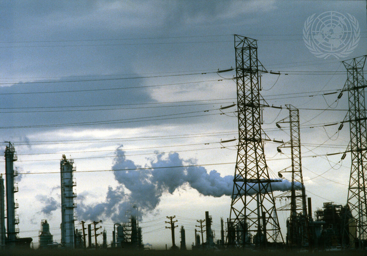 Smokestack of a factory that is in operation in New Jersey emitting smoke into the atmosphere.