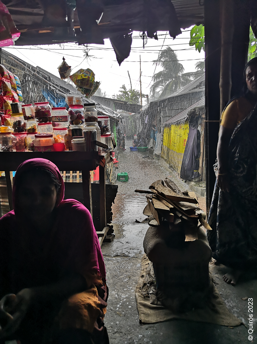 Monsoon rain rushing down on Greenland Slum leaving local sheds flooded and muddy.